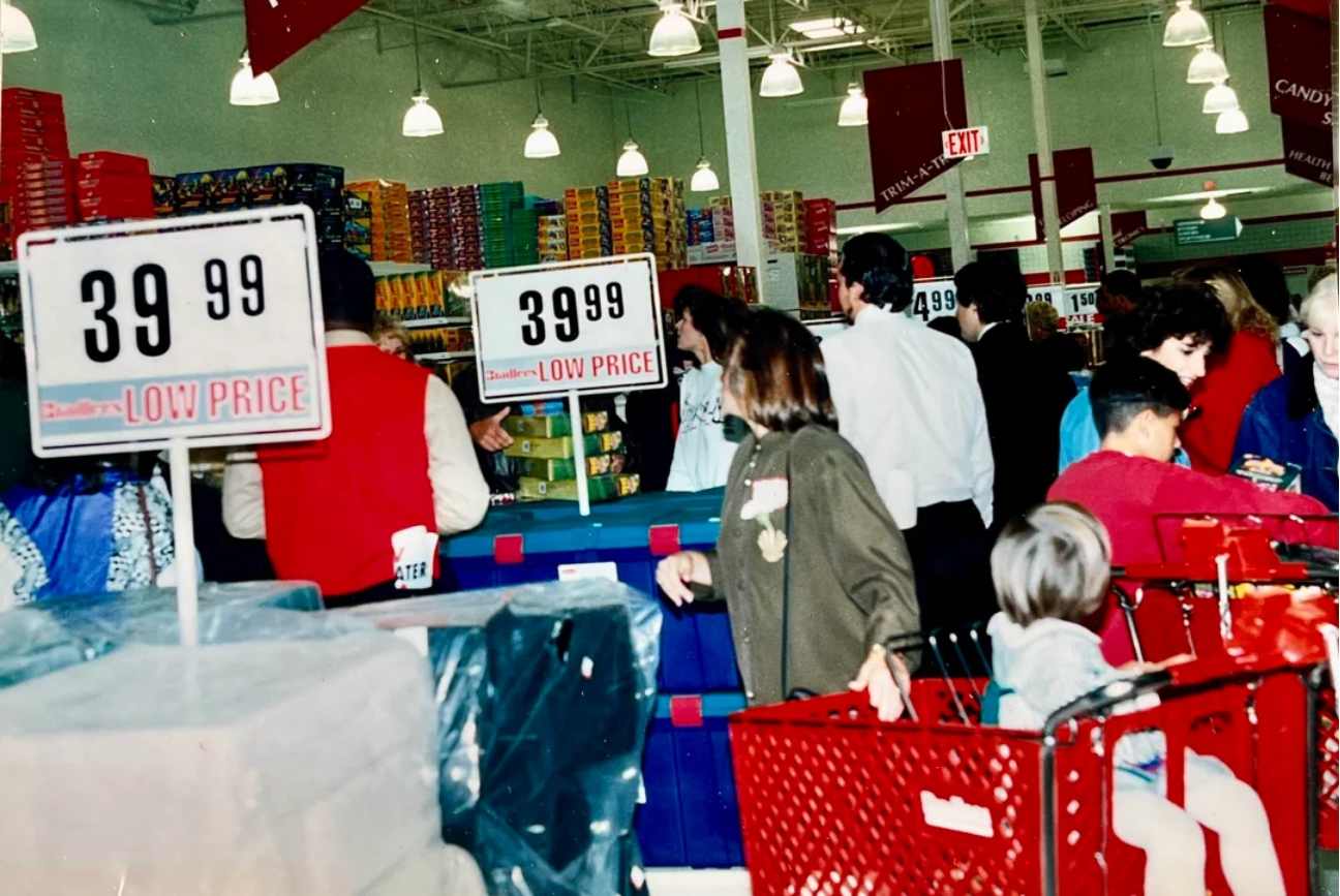 Busy Bradlees checkout lanes with LOW PRICE signs and red shopping carts
